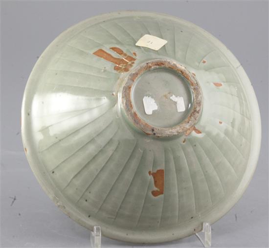 A large Chinese moulded Yaozhou celadon bowl, Jin dynasty (1115-1234), diameter 20.2cm